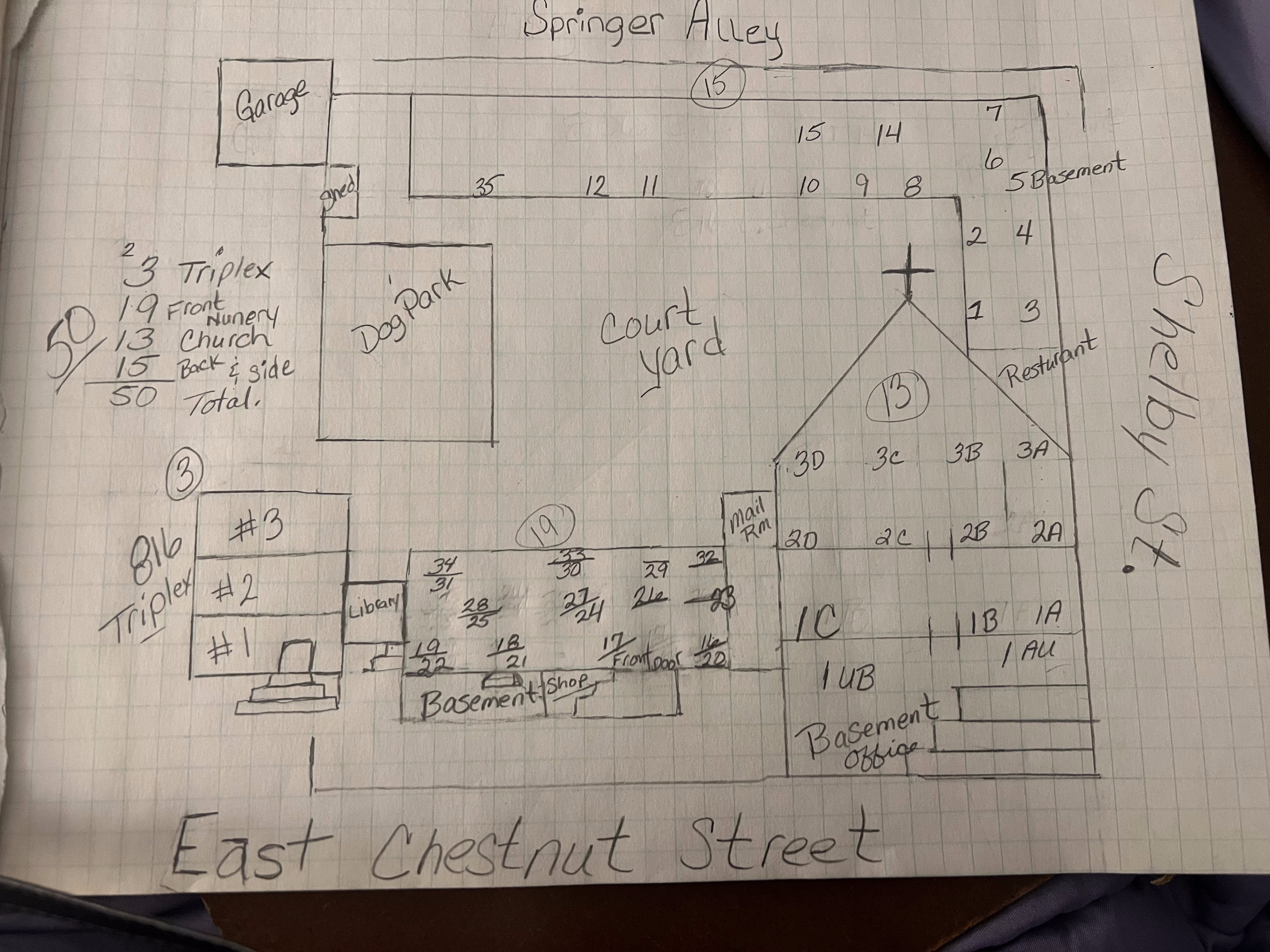 Hand-drawn property sketch on graph paper with detailed unit layout
